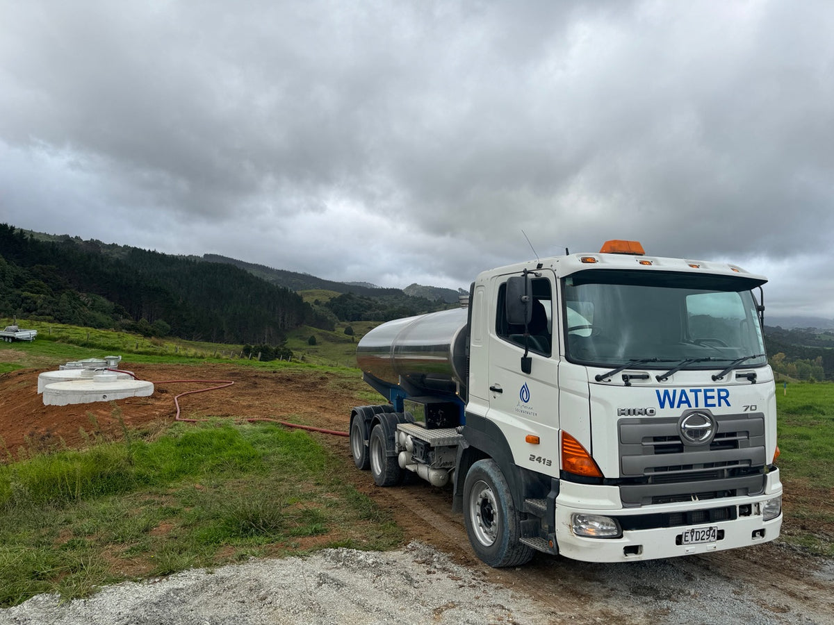 Artesian and Solway Water tanker filling a rural water tank near Auckland